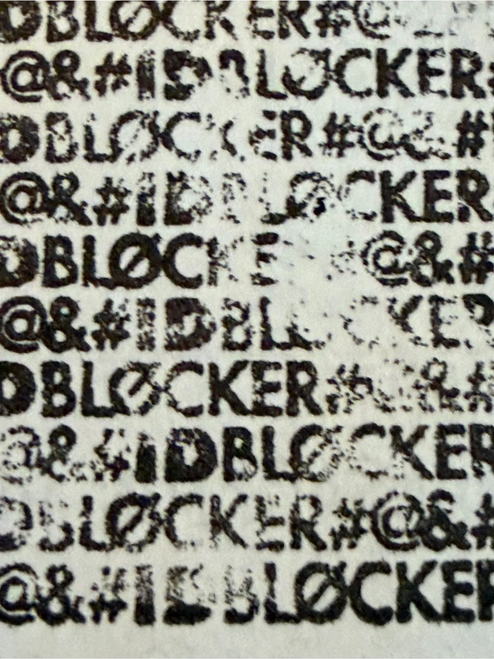 White and Black IDBLOCKER Stamp with Red Logo